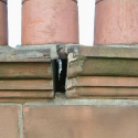 Building Defects - unstable masonry chimney cope